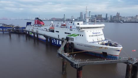 Stena-Line-freight-ship-vessel-loading-cargo-shipment-from-Wirral-terminal-Liverpool-aerial-front-dolly-right-view