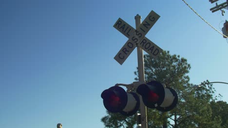 Railroad-Crossing-Signal-Lights-Sign-Blue-Sky