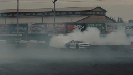 Wide-Shot-of-a-Race-Car-Drifting-and-Leaving-a-Huge-Trail-of-Smoke
