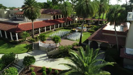 Aerial-View-of-Chairs-Being-Set-Up-for-Wedding-Ceremony-at-Luxury-Resort-on-a-Sunny-Day-in-Florida