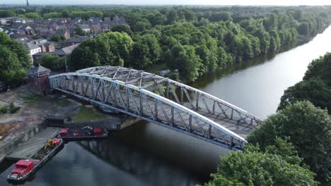 Aerial-descending-view-vehicles-crossing-Manchester-ship-canal-swing-bridge-Warrington-England