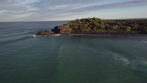 Fingal-Headland-And-Tasman-Sea-Against-Cloudy-Sky-In-New-South-Wales,-Australia---aerial-drone-shot