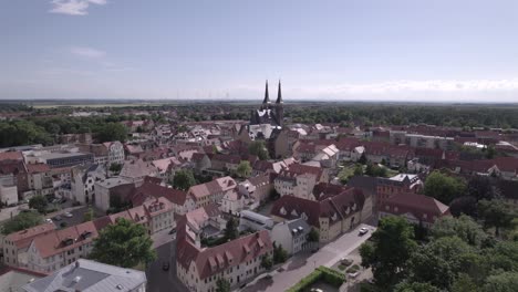 aerial-from-Kothen-city-to-closeup-of-St-jakob-church-during-a-sunny-day