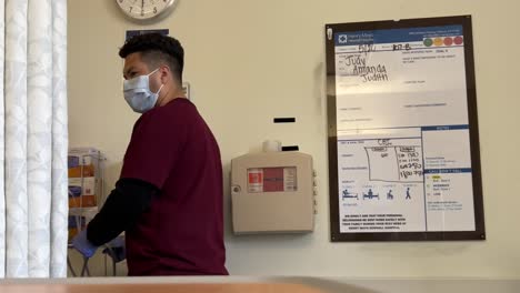 A-patient-care-assistant-PCA-takes-vitals-at-the-Henry-Mayo-Hospital-in-Valencia,-California