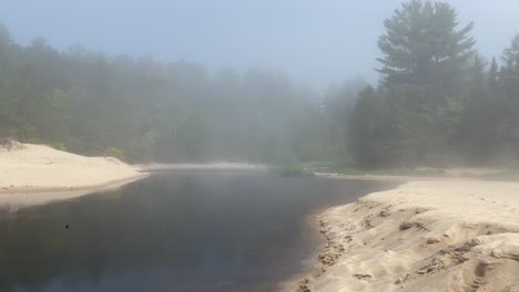 Thick-Fog-Moving-Across-Beach-With-Trees-Miners-Beach-Munising-Michigan