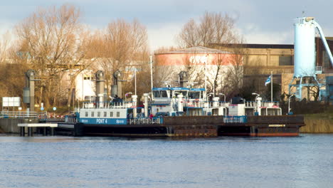 Amsterdam-ferry-leaving-dock-and-crossing-river