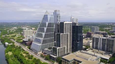 Aerial-view-around-Google-building,-the-Block-185-Office-Tower-and-the-Northshore-Apartments,-in-sunny-Austin,-USA---orbit,-drone-shot
