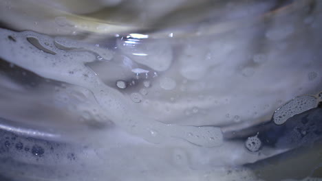 Close-up-od-soap-suds-in-a-laundry-washing-machine
