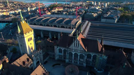 Swiss-National-Museum-aerial-drone-view,-flying-above-Zurich-cityscape,-day