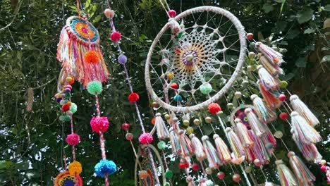 Multicolored-dream-catcher-hanging-on-tree-swaying-in-the-wind
