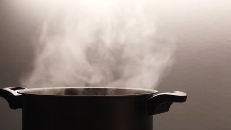 Steam-is-coming-out-of-a-cooking-pot
