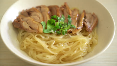dried-noodles-with-stewed-duck-in-white-bowl---Asian-food-style
