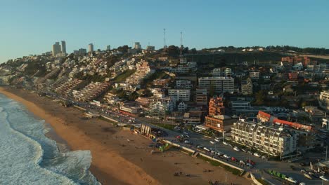 Aerial-view-flying-towards-Reñaca-Chile-scenic-resort-cityscape-golden-beach-waterfront-coastline