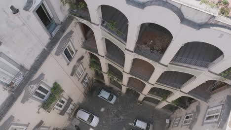 Aerial-footage-slowly-moving-to-the-left-of-the-Palazzo-dello-Spagnolo-in-Naples,-Italy