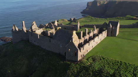 beautiful-drone-shot-of-the-rock-with-the-full-view-of-the-medieval-Scottish-Dunnottar-castle-near-the-sea