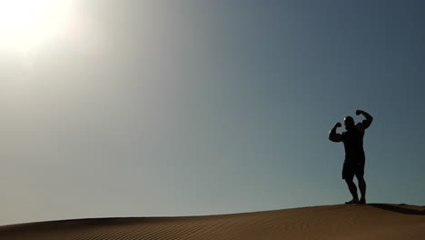 Bodybuilder-flexing-in-Dubai-desert