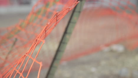 Close-up-on-focused-orange-fencing-with-a-blurred-background-in-Ontario-Toronto-Canada