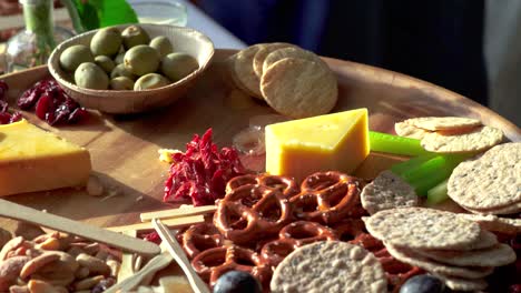 Food-being-picked-off-Charcuterie-board-at-event