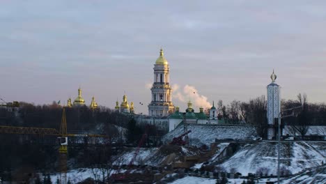 Ukrainian-church,-winter,-birds-fly-in-the-distance