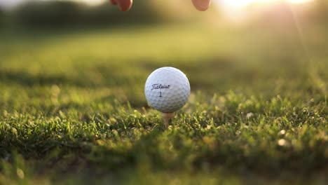 Golfer-Teeing-Up-an-Expensive-Titleist-Golf-Ball-at-Luxury-Golf-Course