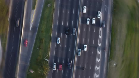 A-dynamic-pivoting-top-down-aerial-footage-above-a-busy-four-lane-highway-in-Buenos-Aires-City