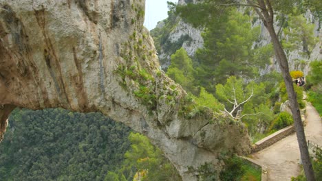 Overview-of-Arco-Naturale,-natural-arch-on-the-east-coastline-of-the-island-of-Capri-at-daytime