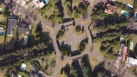 Aerial-top-down-shot-of-roundabout-in-luxury-district-of-Buenos-Aires-with-swimming-pools-in-garden