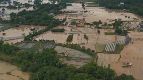 Flood-Water-Causes-Damage-in-Agricultural-Business-in-China,-Aerial-View