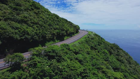 Dynamic-reveal-of-the-eastern-shore-of-Taiwan---Drone-flying-over-cliff-side-highway