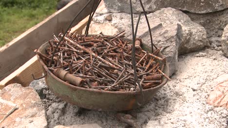 A-bowl-full-of-used-rusty-metal-construction-nails