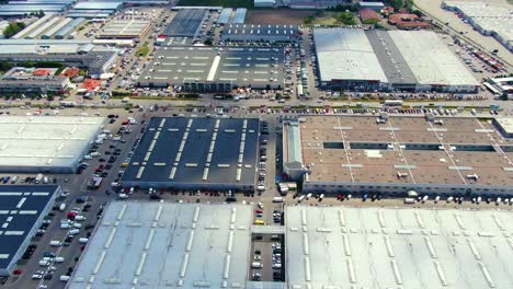 Aerial-footage-of-a-large-shopping-centre-and-car-parks-located-in-the-city