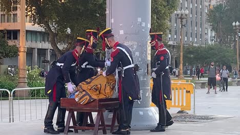 Soldiers-fold-the-national-flag-in-a-carrying-case-at-the-end-of-the-day