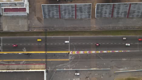 Drone-overhead-view-of-vintage-cars-competition-starting-race-at-race-track-of-Buenos-Aires-autodrome-racetrack-circuit