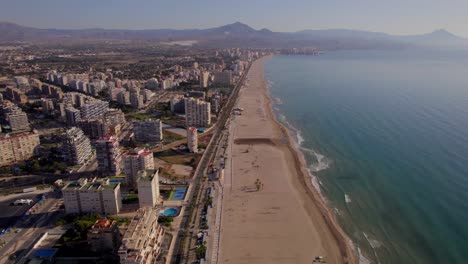 aerial-wide-view-over-San-Juan-coastline-in-Alicante-metropolitan-area-at-dawn,-Valencian-Community,-Spain