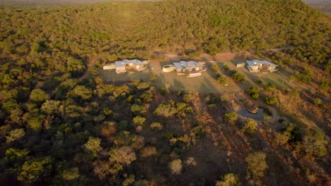 African-wealthy-mansion-properties-in-the-wild-forested-countryside,-aerial-view