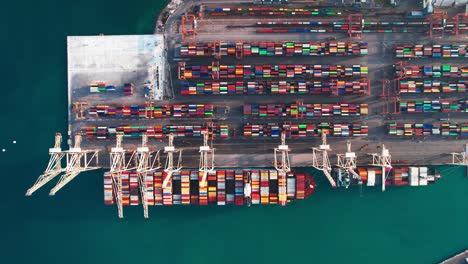 Aerial-Top-Down-View-Of-Port-With-Stacked-Of-Colorful-Containers-And-Cranes-In-Koper,-Capo-D'Istria,-Slovenia