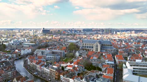 Aerial-shot-of-the-ancient-city-of-Leiden,-the-Netherlands,-flying-towards-the-famous-Rapenburg-canal