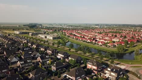 Drone-view-of-two-different-areas-in-Dronten,-Flevoland,-The-Netherlands