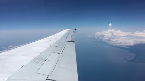 A-thunder-cloud-seen-from-an-airplane,-with-the-right-wing-in-the-foreground