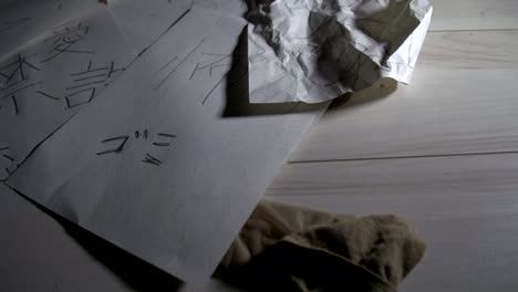 Wrinkled-papers-written-lying-on-the-floor