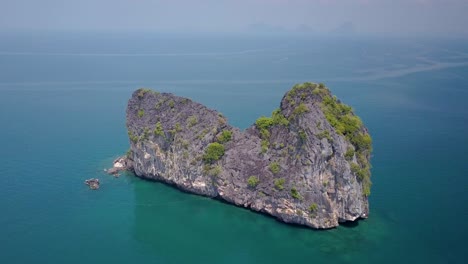 Aerial-arch-shot-of-huge-rock-formation-in-Andaman-Sea-in-Thailand---camera-circling