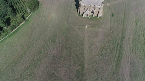 Forward-tracking-aerial-over-the-top-of-St-Catherine's-Chapel-in-Dorset,-England