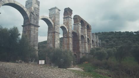 Roman-aqueduct-handheld-among-olive-trees-Moria-Lesvos-island