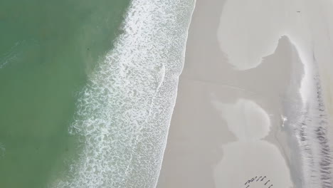 Dramatic-aerial-of-surfing-along-coast-in-South-Africa