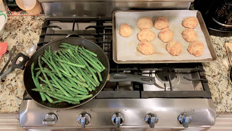 Kitchen-stove-top-with-asparagus-sautéed-and-cheese-biscuits