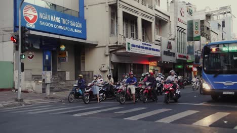 Motorbikes-waiting-at-traffic-light-ready-to-drive-in-South-East-Asia,-Vietnam