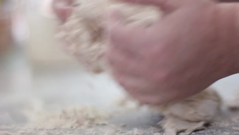 Close-up-on-Mom's-hands-as-she-kneads-the-dough