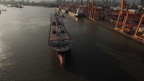 Logistic-concept-aerial-View-of-maritime-transport-commercial-dockyard-with-cargo-ships,-containers-waiting-to-be-Upload-and-Offload-Cargo-Containers