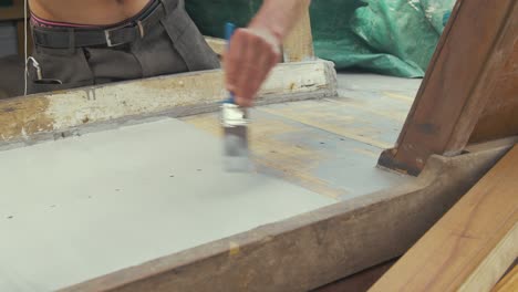 Painting-teak-planking-with-aluminium-based-wood-primer,-TIME-LAPSE