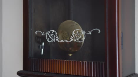 Pendulum-swinging-on-an-old-pendulum-clock